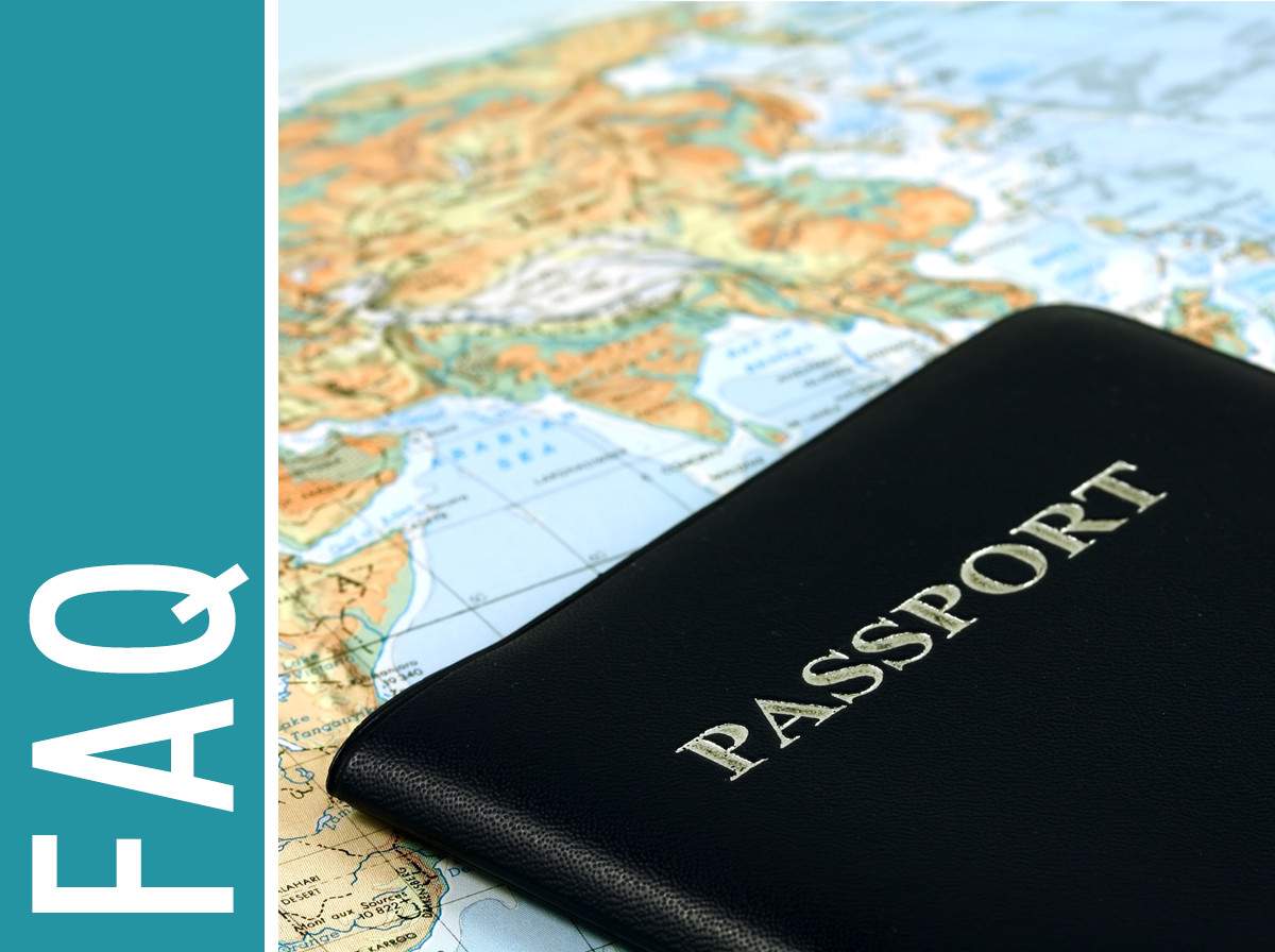 Frequently Asked Questions - a passport on top of a map of the world